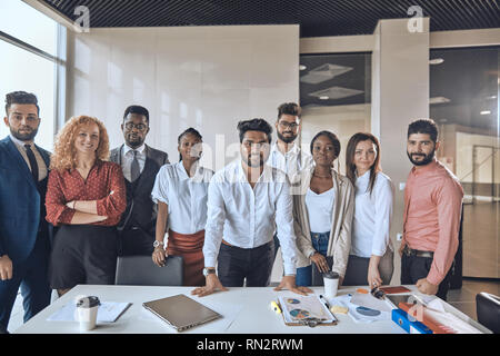 Indian leader is responsible for his company. ambitious young diverse people follow their talented Hindoo boss Stock Photo