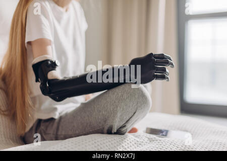 close up cropped photo. focus on the iron robotic arm.prosthetic amputee rehabilitation. Stock Photo