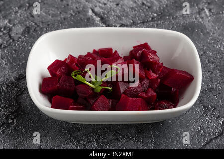 fresh tasty beetroot salad with greens in white bowl Stock Photo