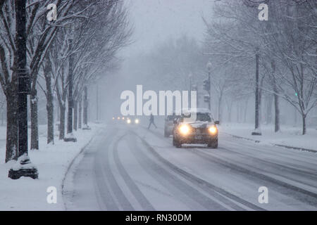 Car traffic on Independence Avenue in snow Washington DC USA Stock Photo