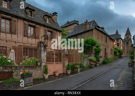 Conques, Midi Pyrenees, France - June , 2015: View of the medieval village of Conques and the Abbey Church of Saint Foy Stock Photo