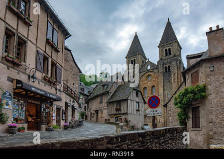 Conques, Midi Pyrenees, France - June , 2015: View of the medieval village of Conques and the Abbey Church of Saint Foy Stock Photo