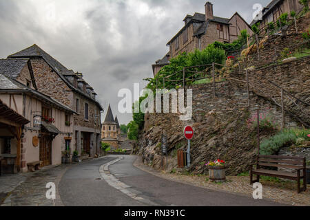 Conques, Midi Pyrenees, France - June , 2015: View of the medieval village of Conques and the Abbey Church of Saint Foy Stock Photo