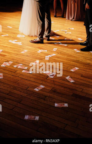 wedding party money scattered on the floor Stock Photo