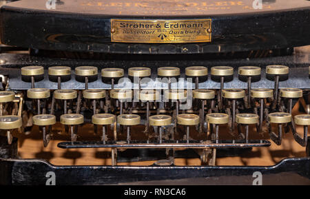 Berlin, Germany - February 14, 2019: Detail of a historic dusty portable typewriter made in Germany during the twenties of the 20th century. Stock Photo