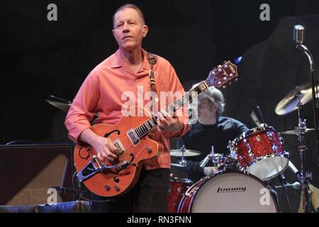 Singer, songwriter and guitarist Jim Heath is shown performing on stage during a 'live' concert appearance with The Reverend Horton Heat. Stock Photo