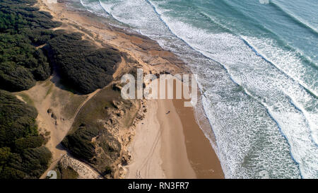 Aerial photo of two people walking on a wild beach in Vendee, France Stock Photo