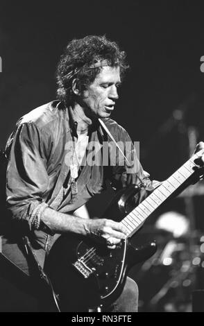 Guitarist, songwriter, singer, record producer Keith Richards, founding member of The Rolling Stones, is shown performing on stage during a 'live' solo concert appearance. Stock Photo