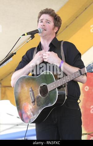 Singer, songwriter and guitarist Josh Ritter is shown performing on stage during a 'live' concert appearance. Stock Photo