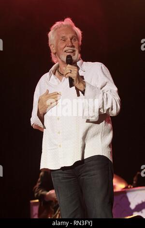 Singer, songwriter, photographer, record producer, actor and entrepreneur Kenny Rogers is shown performing on stage during a 'live' concert appearance. Stock Photo