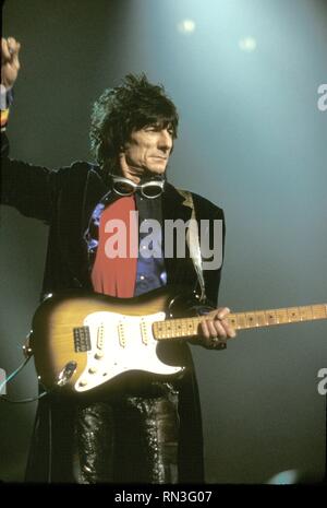 Guitarist Ron Wood of the Rolling Stones is shown performing on stage during a 'live' concert appearance. Stock Photo