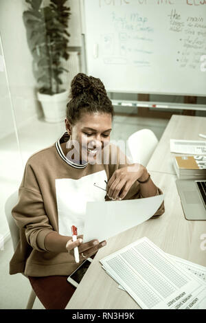 Professional office manager reading some important reports Stock Photo