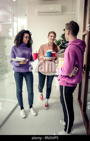 Student group having break between lessons Stock Photo - Alamy