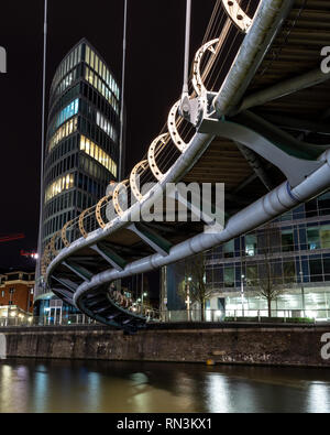 Bristol, England, UK - January 12, 2019: Modern office and apartment buildings are lit at night on Temple Quay, beside Valentine's Bridge on Bristol's Stock Photo