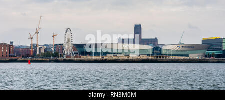 Liverpool, England, UK - November 4, 2015: Liverpool's gothic cathedral tower rises from behind the Echo Arena and BT Convention Centre building on th Stock Photo