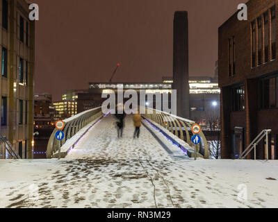London, England, UK - February 28, 2018: Pedestrians cross the River Thames from Bankside Tate Modern on the Millennium Bridge during the 'beast from 