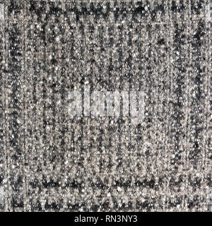 Real heather knitted fabric made of wool fibres textured background. Greey fabric texture. Background with delicate striped pattern. Stock Photo