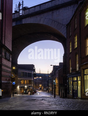 Newcastle, England, UK - February 5, 2019: The East Coast Mainline railway crosses a viaduct high above the streets and houses of Newcastle's old Quay Stock Photo