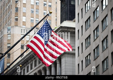 Wall street American flag in the Financial District of Lower Manhattan