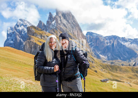 Couple hiking in the Dolomites, South Tyrol, Italy Stock Photo