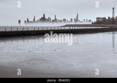 view of Chicago looking  across a jetty with low fog Stock Photo