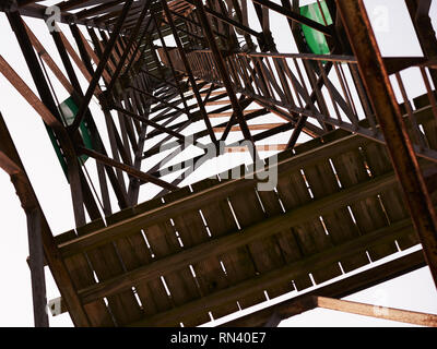 standing directly under wooden structure, looking up Stock Photo