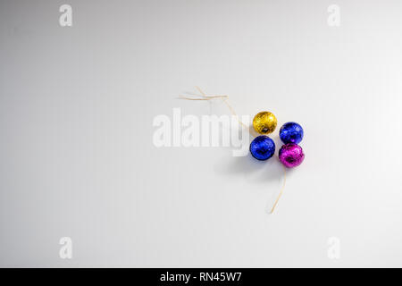 colorful shiny easter eggs on white background. Stock Photo