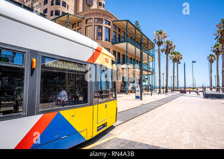 31st December 2018 , Glenelg Adelaide South Australia : Adelaide tram at the terminus at Moseley square in Glenelg and view of the beach and jetty in  Stock Photo