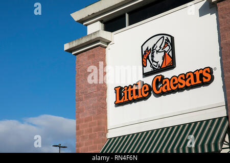 A logo sign outside of a Little Caesars restaurant location in Winchester, Virginia on February 13, 2019. Stock Photo