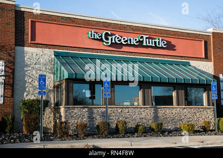 A logo sign outside of a The Green Turtle restaurant location in Dulles, Virginia on February 14, 2019. Stock Photo