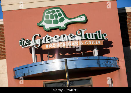 A logo sign outside of a The Green Turtle restaurant location in Dulles, Virginia on February 14, 2019. Stock Photo