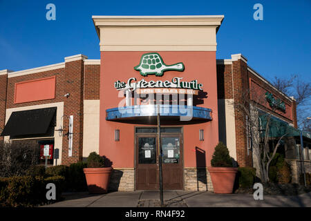 A logo sign outside of a The Green Turtle restaurant location in Dulles, Virginia on February 14, 2019. Stock Photo