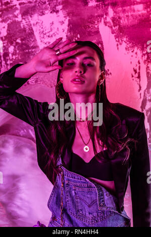 Beautiful nice woman holding a hand in front of herself Stock Photo