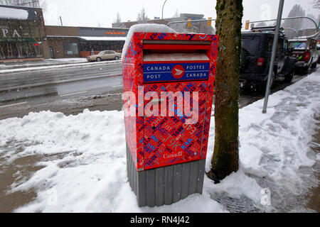 A Canada Post collection box in the snow, Vancouver, British Columbia, Canada Stock Photo