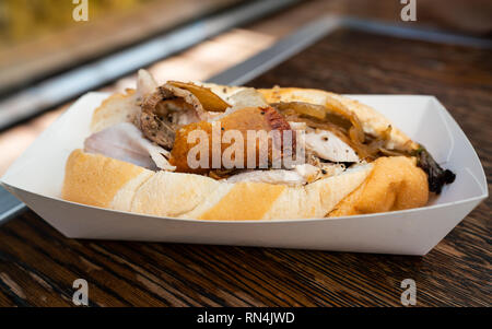 Pulled pork bun sandwich with crusty skin close-up view Stock Photo
