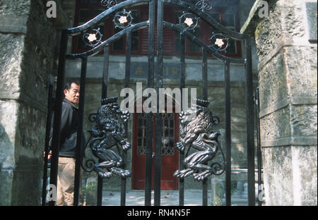 Caption: Lushan, Hefei, China - Nov 2002. The gates to a mansion in the old European hill station of Lushan, a small town above the Yangtze River.  Lu Stock Photo