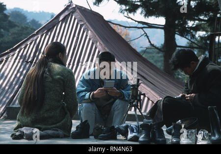 Caption: Lushan, Hefei, China - Nov 2002. Playing cards in the old European hill station of Lushan, a small town above the Yangtze River.  Lushan, a h Stock Photo