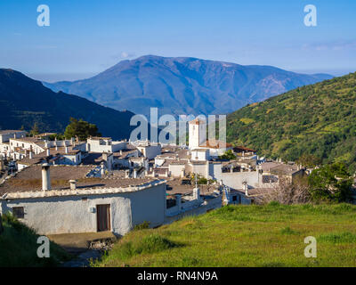 A view over Capileira, the highest and most northerly village in the Poqueira river gorge, in the Alpujarra region in the Sierra Nevada, Andalusia, Sp Stock Photo