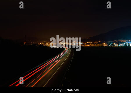 Long exposure Car Light trail at night in the highway Stock Photo
