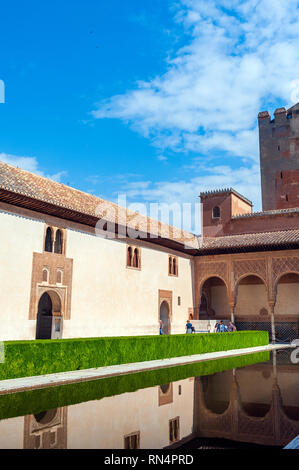 The Patio de los Arrayanes, Court of the Myrtles, at the Alhambra, a 13th century Moorish palace complex in Granada, Spain. Built on Roman ruins, the  Stock Photo