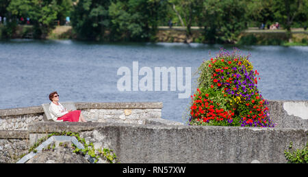 FRANCE VILLANDY SEP 2018 view of a woman enjoying sunshine near Loire river. Stock Photo