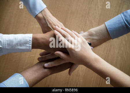 View from above of stacked business people hands  Stock Photo