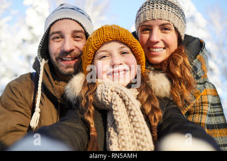 Family Taking Selfie in Winter Stock Photo