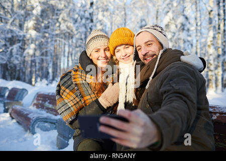 Family Taking Photo in Winter Stock Photo
