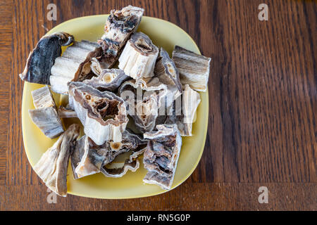 Pieces of Dried Nigerian Stockfish to prepare soups Stock Photo