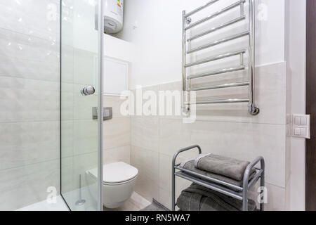 Modern bathroom interior with shower cabin and white toilet bowl Stock ...