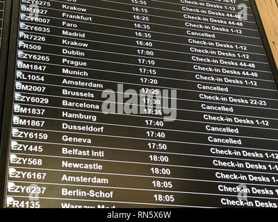 A departure board at Bristol Airport showing flybmi flights cancelled following the collapse of the airline. Stock Photo