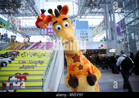 New York, USA. 16th Feb, 2019. Personnel with giraffe costume pose at the 116th Annual North American International Toy Fair at the Jacob K. Javits Convention Center in New York, the United States, Feb. 16, 2019. The toy fair, held from February 16 to 19 this year, gathered more than 1,000 toy exhibitors and hundreds of thousands of toys and youth entertainment products to retail outlets and trade guests from over 100 countries and regions. Credit: Wang Ying/Xinhua/Alamy Live News Stock Photo