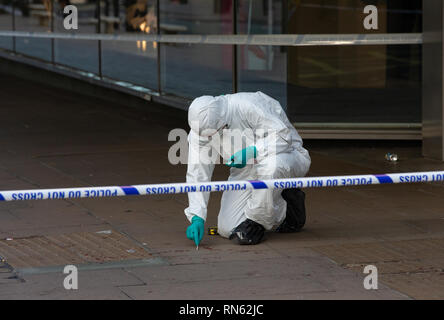 London, UK. 17th Feb 2019. A forensic team take swabs of blood, measurements and remove evidence after 3 men were stabbed. A fight broke out outside Tape nightclub in Mayfair in the early hours of the morning. Two men have been arrested on suspicion of attempted murder. Triple stabbing near Oxford Street, London. Credit: Tommy London/Alamy Live News Stock Photo