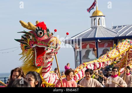 Eastbourne, UK. 17th Feb 2019. A Chinese dragon is paraded on the streets of Eastbourne as part of todays Chinese New Year celebrations, East Sussex.  Credit: Ed Brown/Alamy Live News Stock Photo